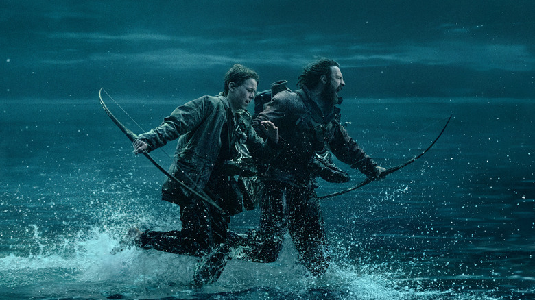 Spike and Jamie running across the causeway in 28 Years Later