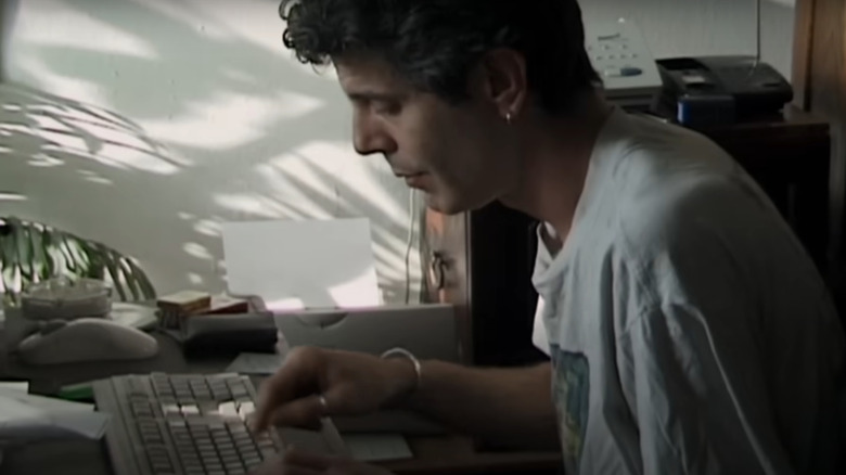 Roadrunner: A Film About Anthony Bourdain, shot of young Bourdain typing up 'Kitchen Confidential.'