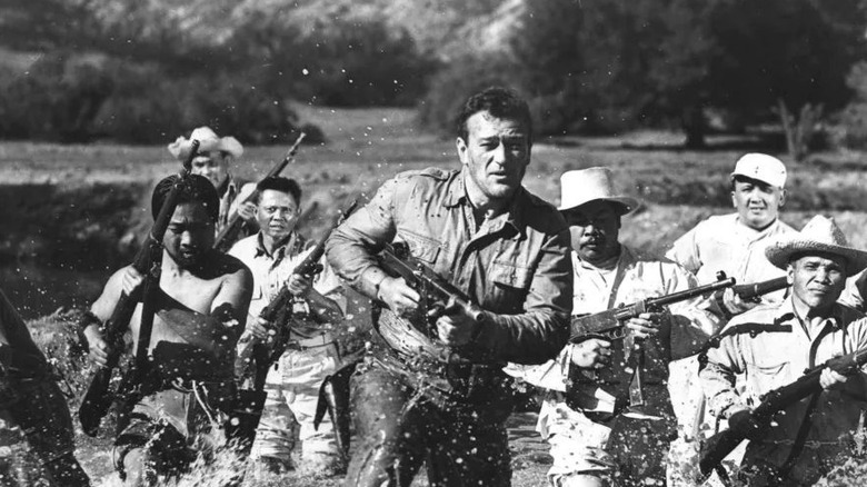 Madden (John Wayne) leads Filipino guerrillas in Back to Bataan