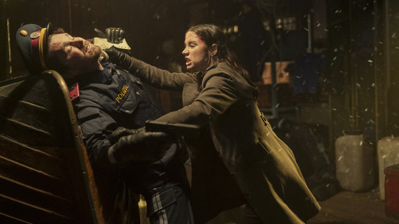 Eve stabs a cop in the neck in Ballerina