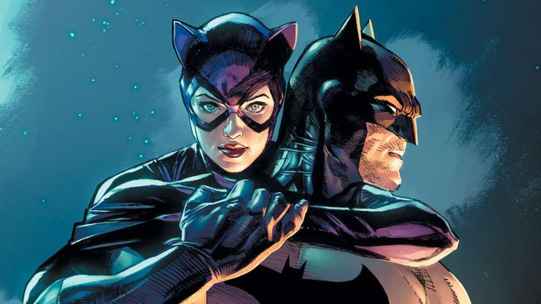 Catwoman wraps her arms around Batman in DC Comics