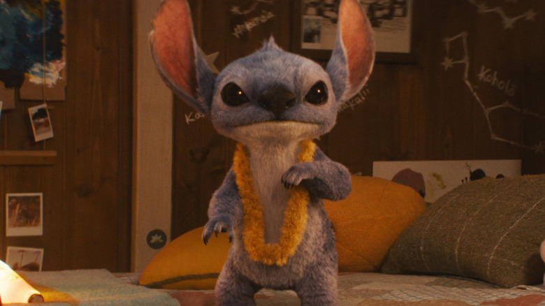 Stitch standing on the bed in Lilo & Stitch (2025)
