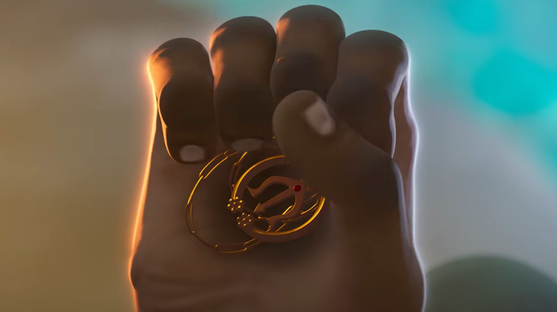 B'kai holding a Greek amulet in Eyes of Wakanda