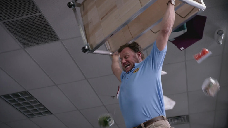 Tallahassee lifting a desk to smash a zombie in Zombieland: The Series
