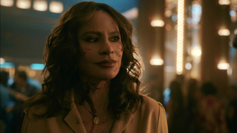 A bloodied Griselda Blanco (Sofía Vergara) glances to her left confidently in Griselda