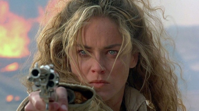Sharon Stone pointing a gun in the final shootout of The Quick and the Dead