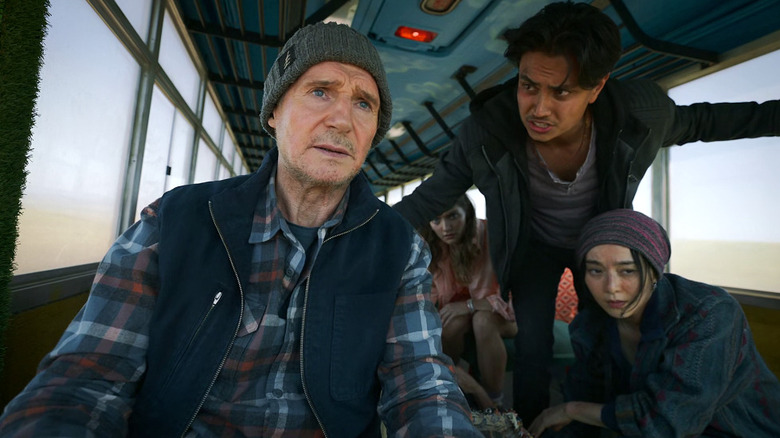 Mike McCann surrounded by worried passengers in "Ice Truck: Vengeance"