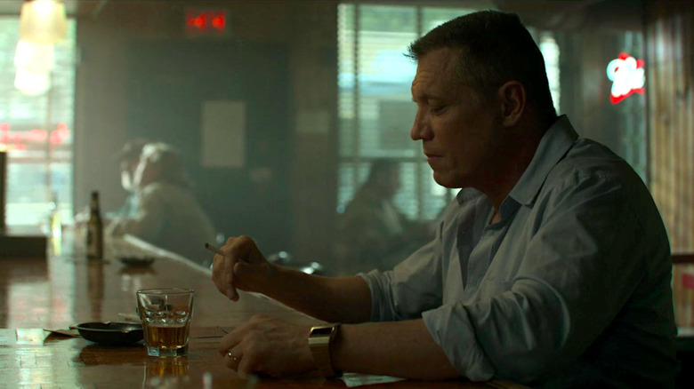 Bill Tench sits at a bar and smokes in 