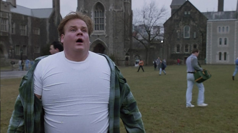 Chris Farley's Tommy, in a white shirt and out of breath on the college quad in Tommy Boy