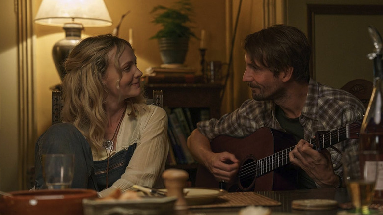 Herb and Nell singing at Charles' table in The Ballad of Wallis Island