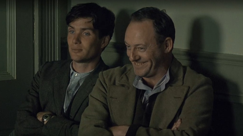 Damien O'Donovan (Cillian Murphy) and Dan (Liam Cunningham) sitting together in The Wind That Shakes the Barley.
