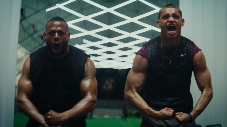 Marlon Wayans as Isaiah White and Tyriq Withers as Cameron Cade flexing and yelling during an intense training moment in Him