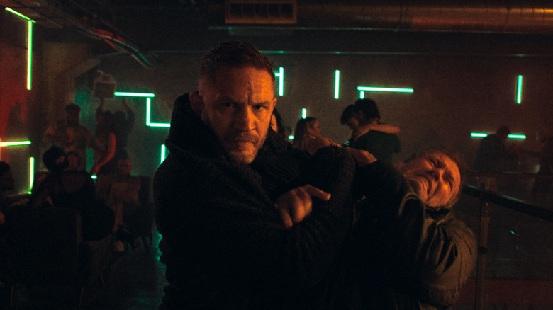 Tom Hardy's Walker fights with a thug on the upper level of a club in Havoc