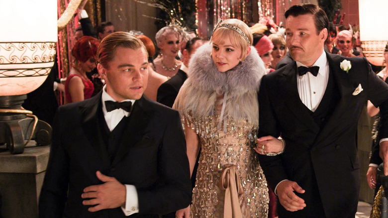 Leonardo DiCaprio's Jay Gatsby shows the Buchanans around one of his parties in The Great Gatsby.