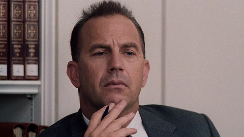 Kevin Costner stroking his chin as Kenneth O'Donnell in Thirteen Days
