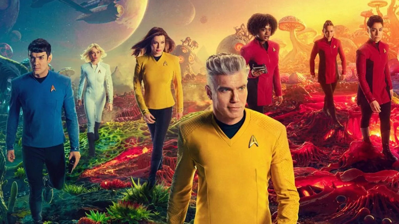 The cast of Star Trek: Strange New Worlds walking across an alien landscape