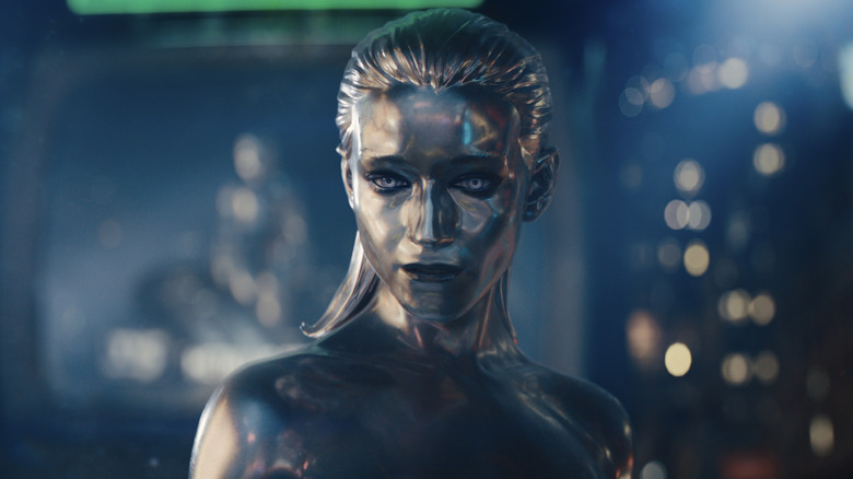 Julia Garner's Silver Surfer flies in front of a vast machine in Marvel Studios' The Fantastic Four: First Steps.