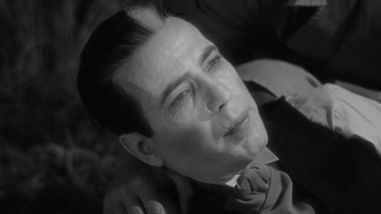 Humphrey Bogart as Dr. Xavier being held upright in The Return of Doctor X