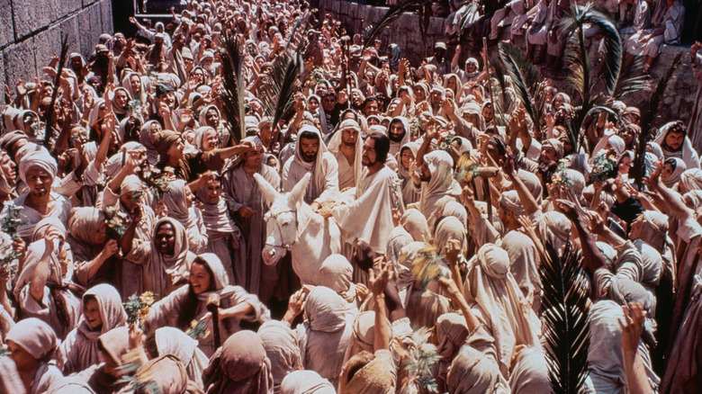Jesus Christ surrounded by his followers in The Greatest Story Ever Told