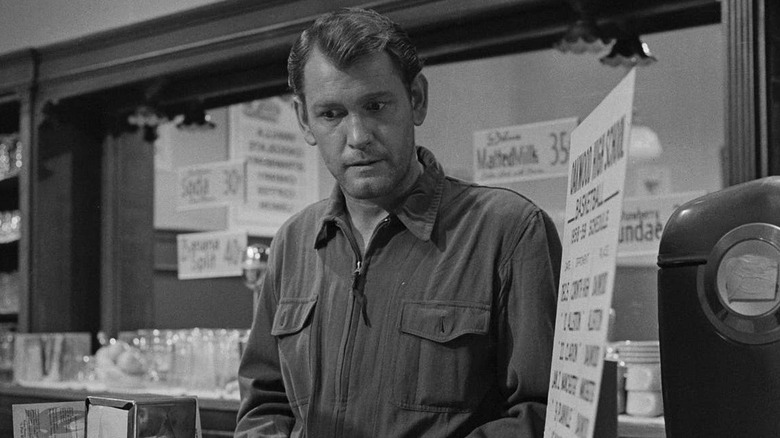 A panicked in an empty soda shop in The Twilight Zone