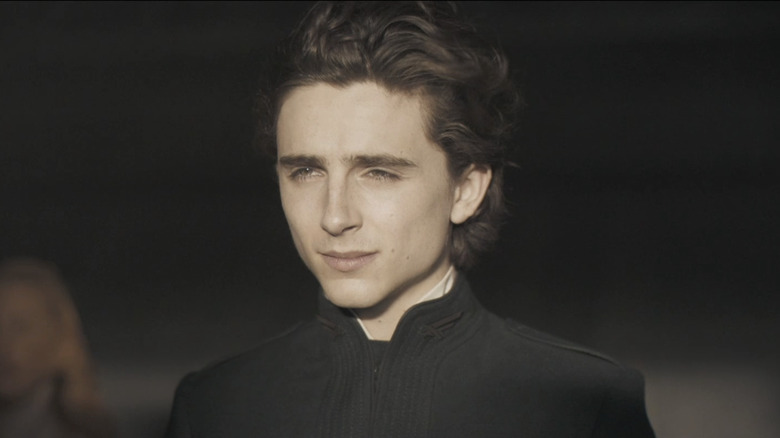 Timothée Chalamet's Paul Atreides stands in bright sunlight in Dune