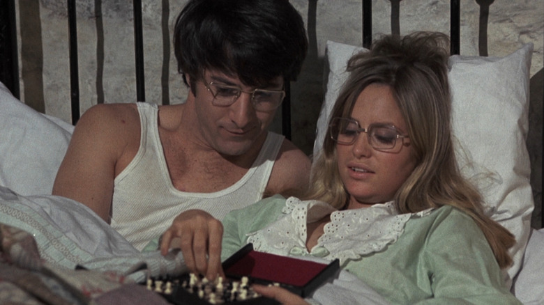 Dustin Hoffman and Susan George as David and Amy Sumner sitting in bed in Straw Dogs
