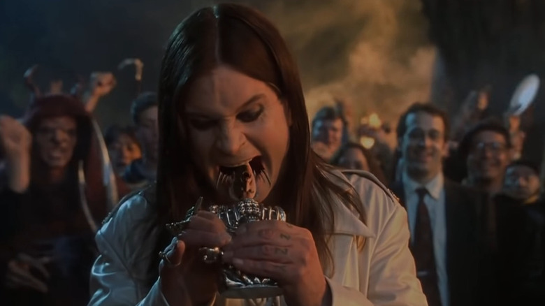 Ozzy spitting a bat's head into a bottle in 