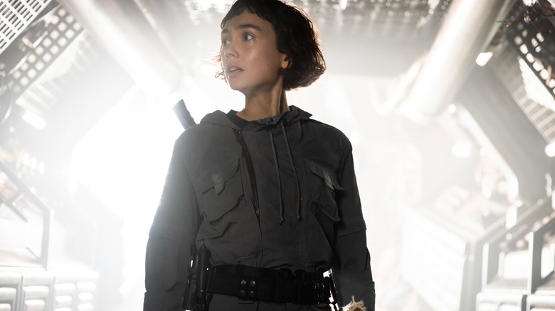 A terrified Wendy surveys her surroundings in Alien: Earth