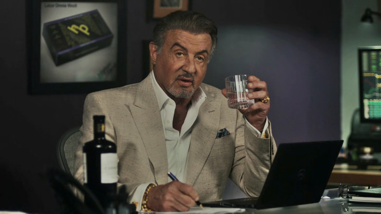 Sylvester Stallone as Dwight holding a glass in Tulsa King season 2