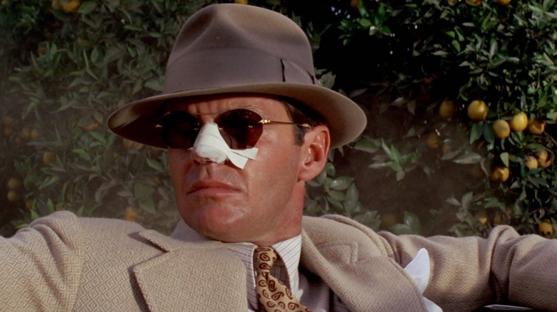 Jack Nicholson as Jake with a bandaged nose in Chinatown