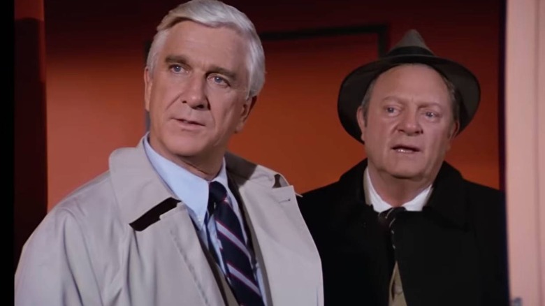 Frank Drebin (Leslie Nielsen) and Ed Hocken (Alan North) in a doorway on Police Squad!