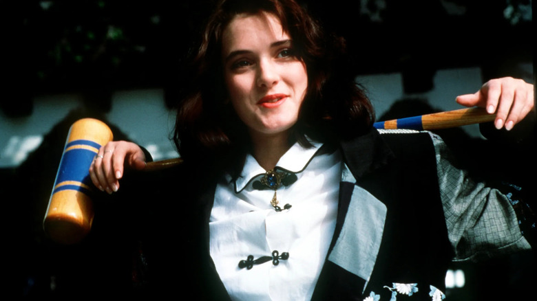 Winona Ryder strikes a pose with a croquet mallet as Veronica Sawyer in Heathers