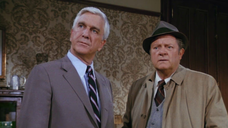 Frank Drebin and Ed Hocken wearing suits in Police Squad!