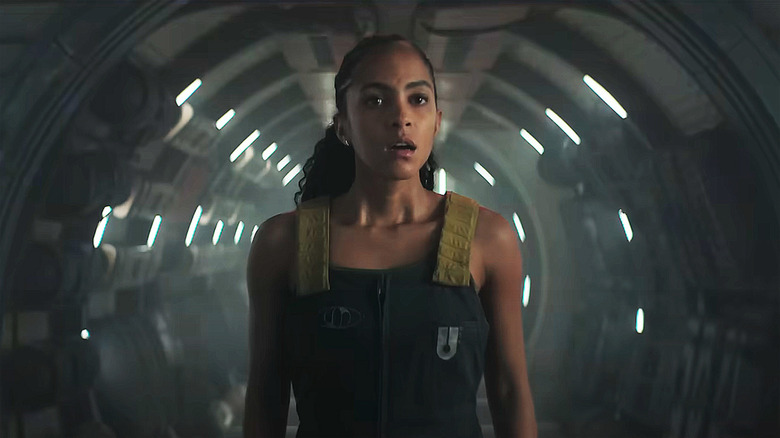 Gaal Dornick (Lou Llobell) standing in a space ship in 