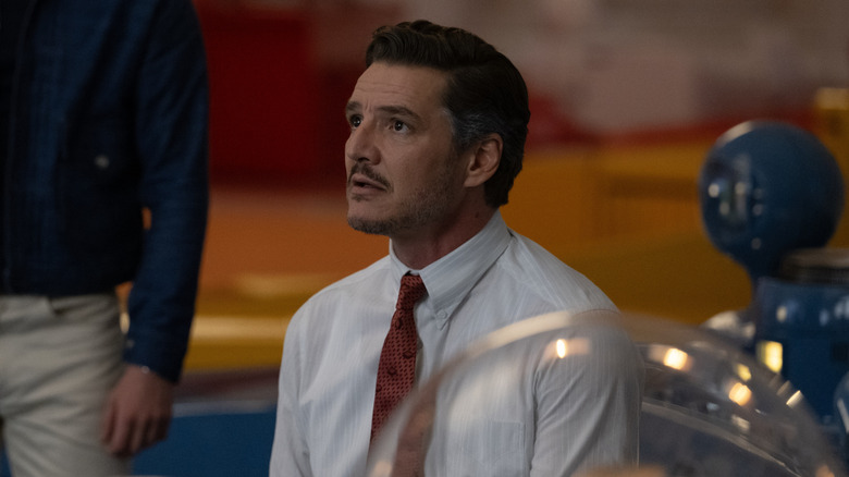 Pedro Pascal as Reed Richards looking up with concern in The Fantastic Four: First Steps