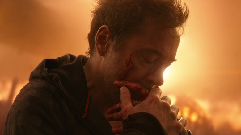 Robert Downey Jr. as Tony Stark sitting, devestated after Spider-Man has been dusted, in Avengers: Infinity War