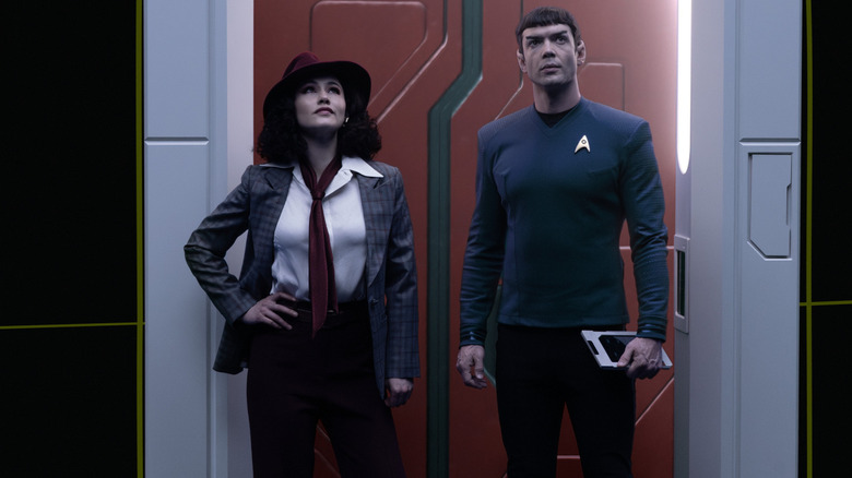 La'an dressed as a 1960s detective and Spock standing on a holodeck on Star Trek: Strange New Worlds