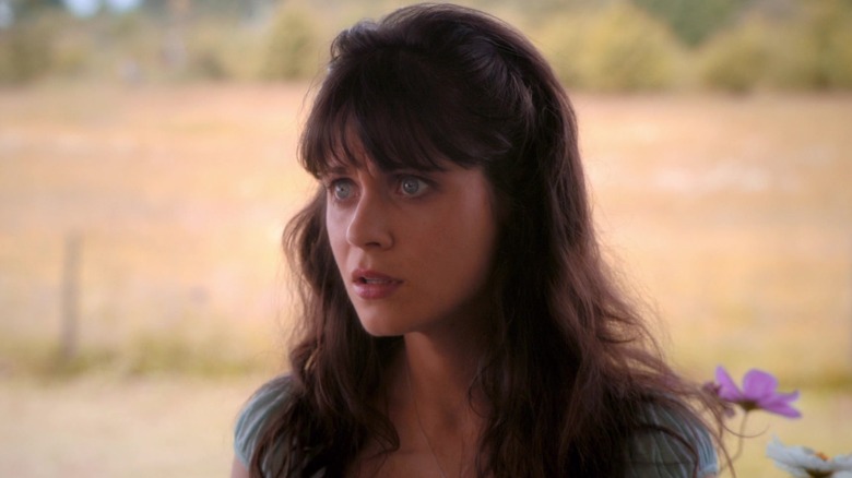 Zooey Deschanel as DG, wearing a blue dress and looking shocked, in Tin Man