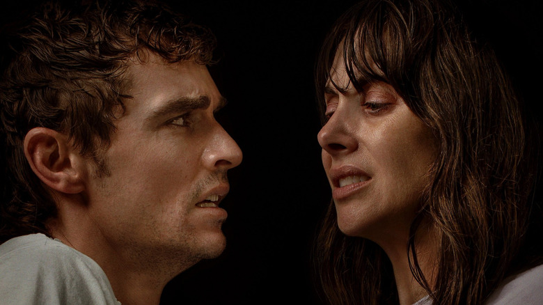 Dave Franco as Tim and Alison Brie as Mille very sweaty and face to face on the poster for Together