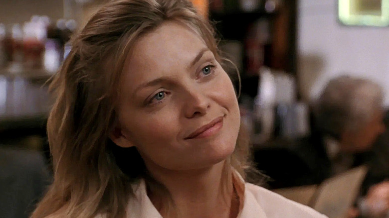 Frankie, smiling in a diner in Frankie and Johnny