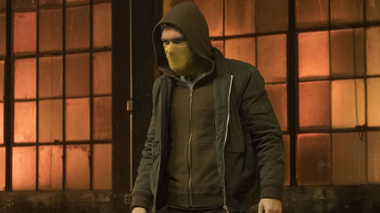Danny Rand wearing a yellow scarf in Iron Fist