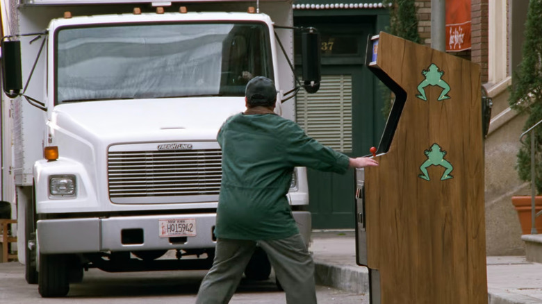 George Costanza standing in front of a moving truck in Seinfeld