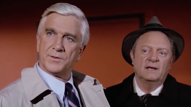 Leslie Nielsen as Frank Drebin and Alan North as Ed Hocken in parody TV series Police Squad!.