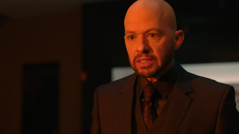Lex Luthor (Jon Cryer) basked in orange light on Supergirl