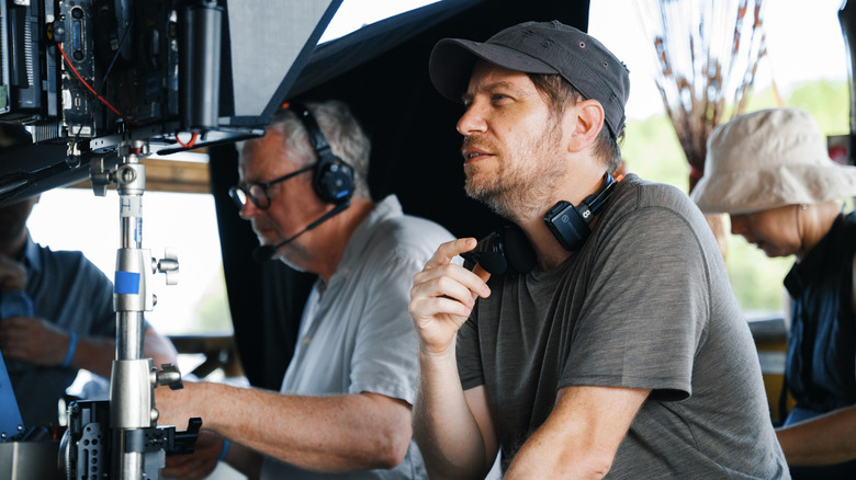 Gareth Edwards looking at a monitor on the set of Jurassic World Rebirth