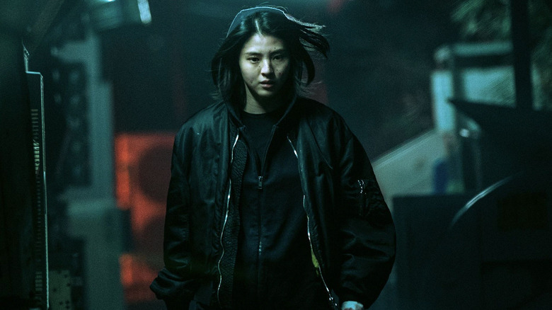 A blood-spattered Yoon Ji-woo (Han So-hee) walks through an alley in My Name