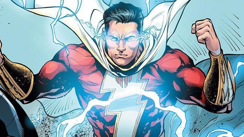 Shazam flexing and surrounded by blue lightning in a comic book panel
