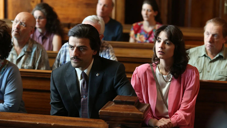 Mayor Nick Wasicsko and his wife Nay Noe sit in the audience of a court house, dressed in formal clothes, in Show Me a Hero