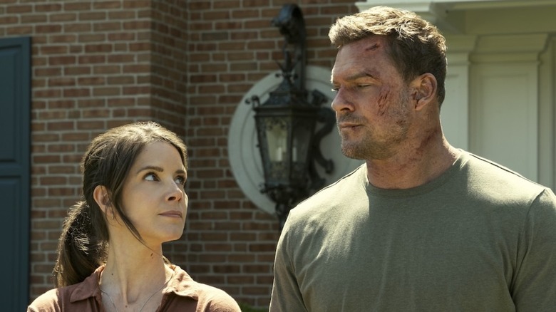 A battered Jack Reacher shares a glance with Duffy the DEA Agent in Reacher season 3