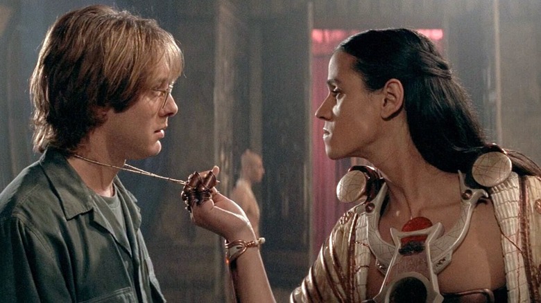 Ra (Jaye Davidson) grabs the amulet worn by Daniel Jackson (James Spader) in Stargate